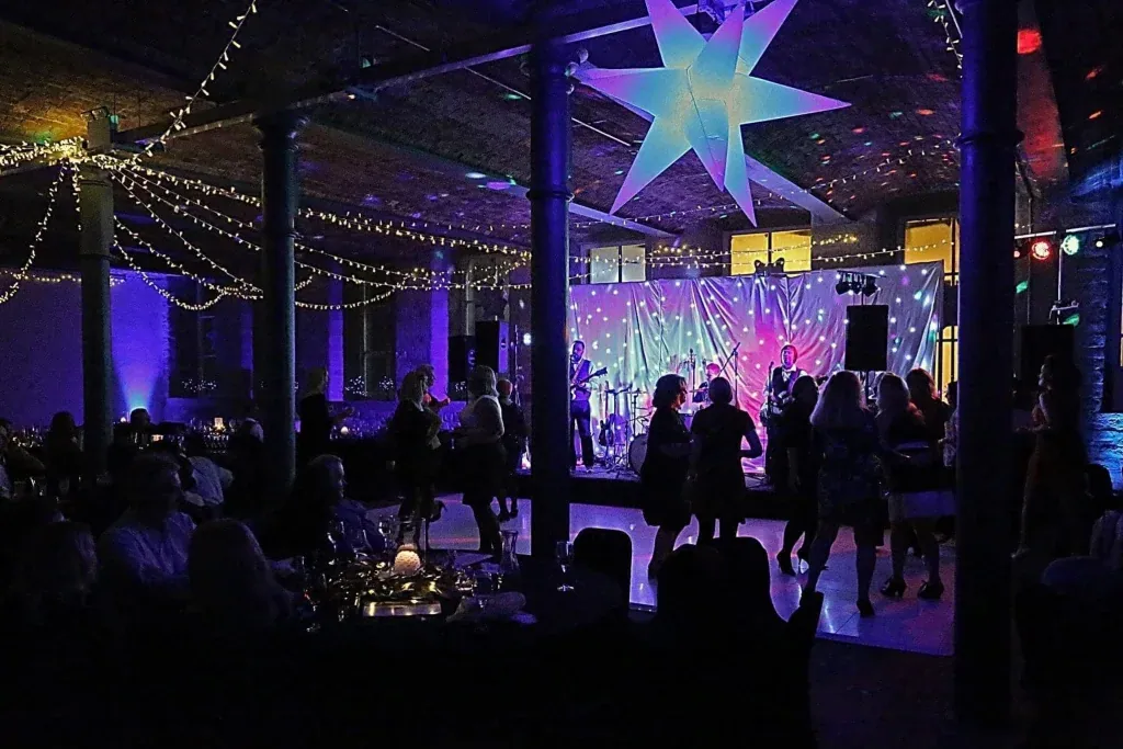 A Christmas party in full swing under the illuminated star at The Arches