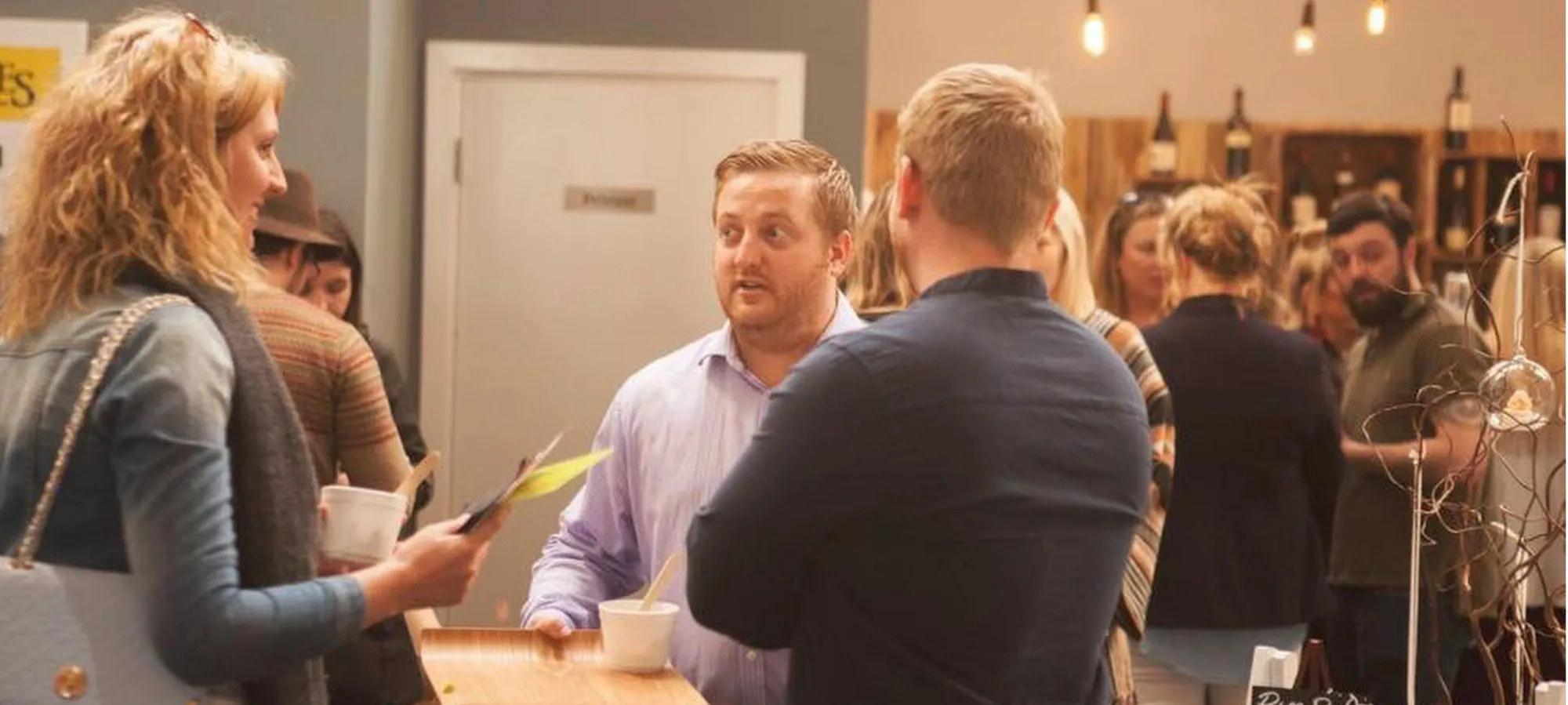 Guests enjoying drinks and conversation at True North
