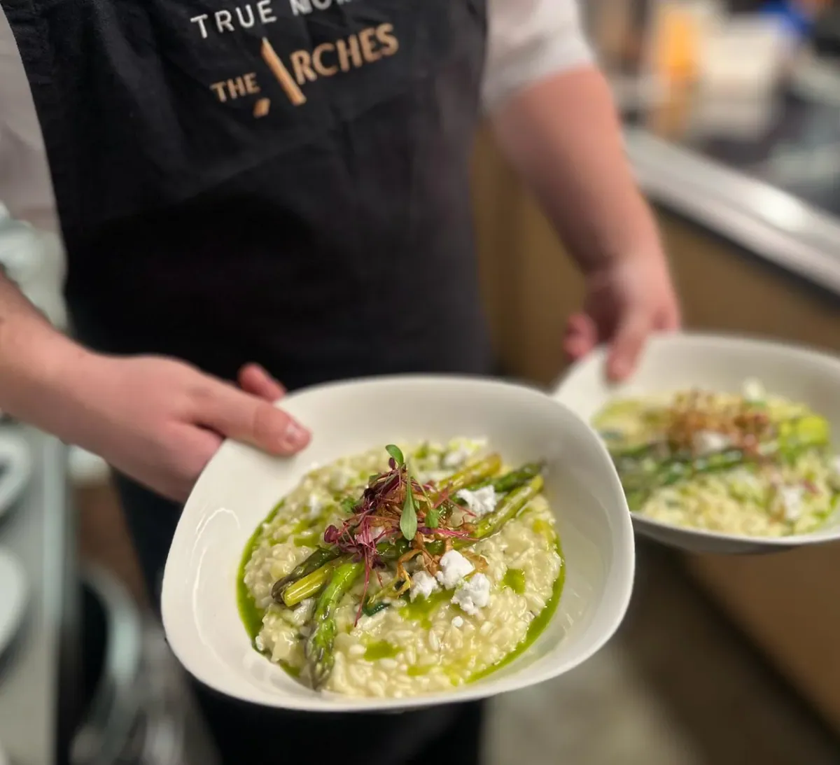 A True North chef plating a dish at The Arches